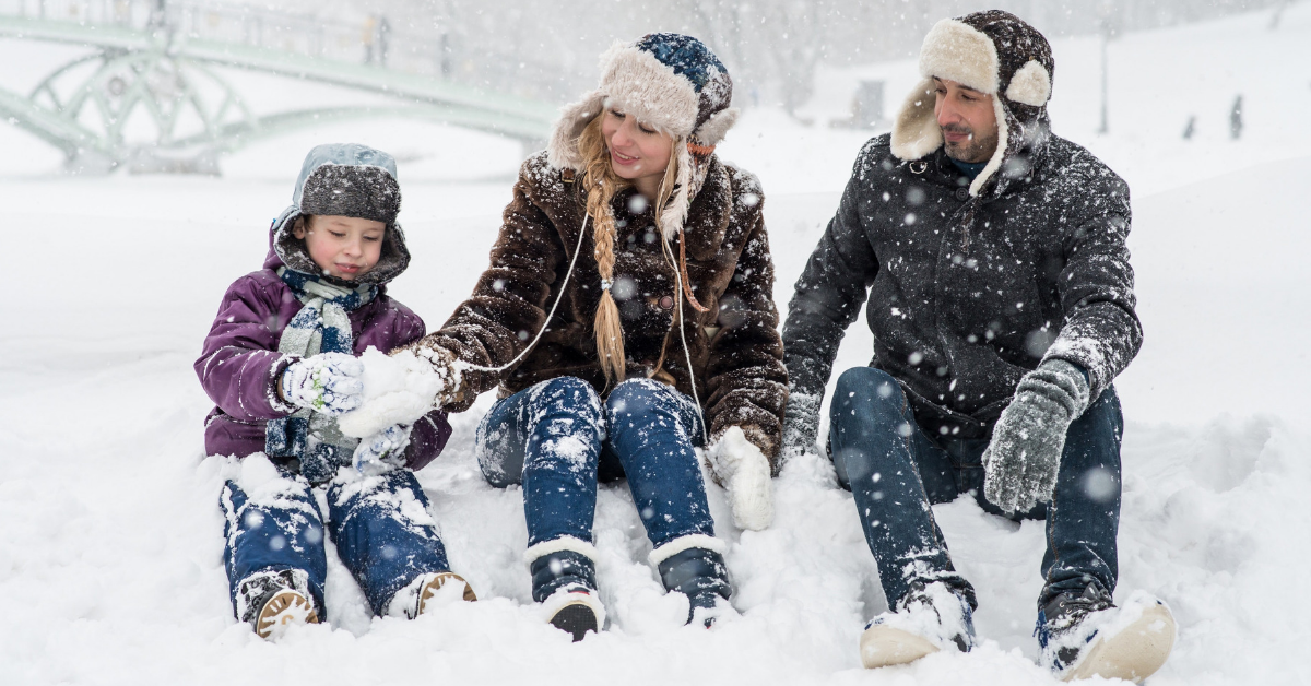 Family playing in the snow